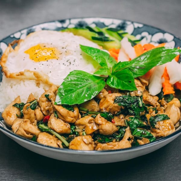 Hên Vietnamese Restaurant's basil chicken with rice, fried egg, and pickled vegetables.